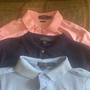 Three Ralph Lauren polo shirts